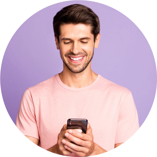 Man smiling with a message icon next to him. ZeroBounce has 99.6% email validation accuracy.