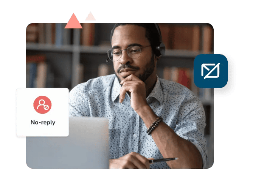 A man wearing a headset sits at his desk and considers a no-reply email.