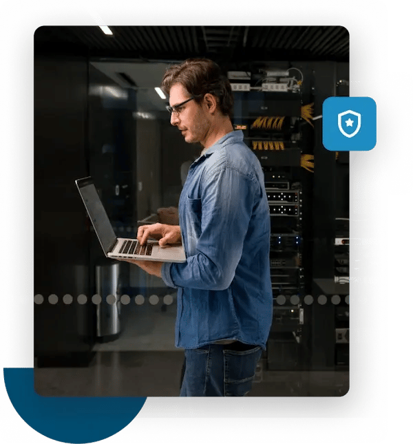 Man on laptop monitors his domain reputation with a free blacklist checker