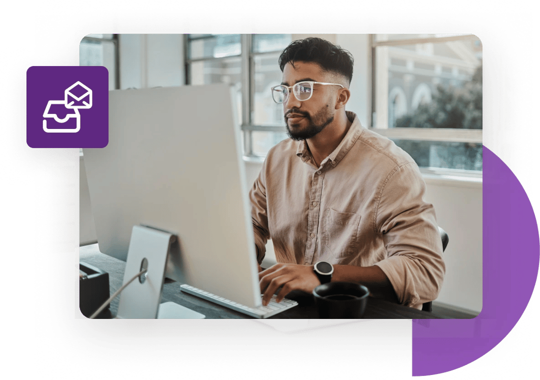 Seated businessman verifies his catch-all emails with email verification