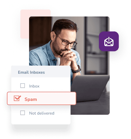 A man with a concerned expression holds his hands to his face as he looks at his laptop and sees that his email has gone to Spam.