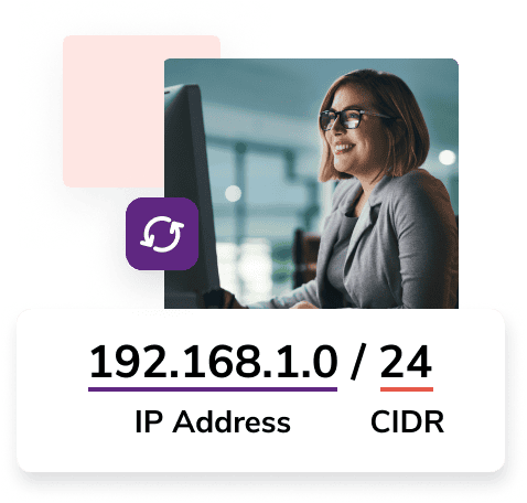 A woman with glasses and a grey blazer smiles in front of her monitor with the CIDR notation '192.168.1.0 / 24.'