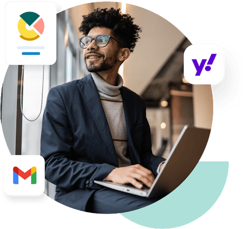 Businessman on his laptop looks to his right at a graph, the Gmail logo, and the Yahoo logo