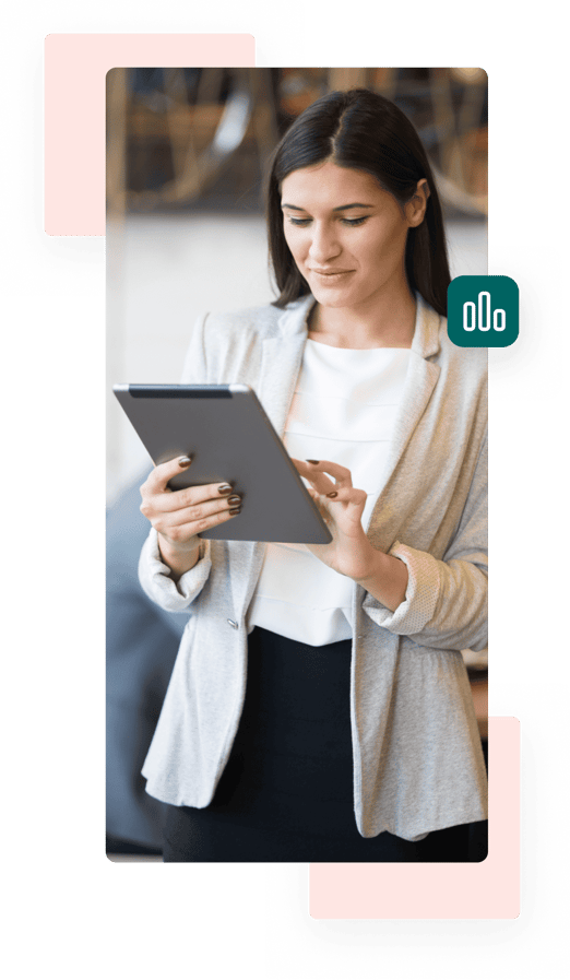 A businesswoman wearing a white top and beige blazer smiles slightly while holding and typing on a tablet.