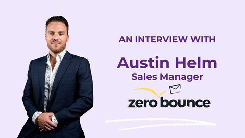 ZeroBounce Sales Manager Austin Helm is shown looking dapper in a suit on a lavender background.