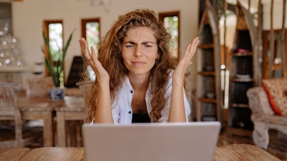 Woman with thick eyebrows is shown looking baffled by her undeliverable email.